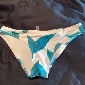 Matching swim bottom to tropical print top